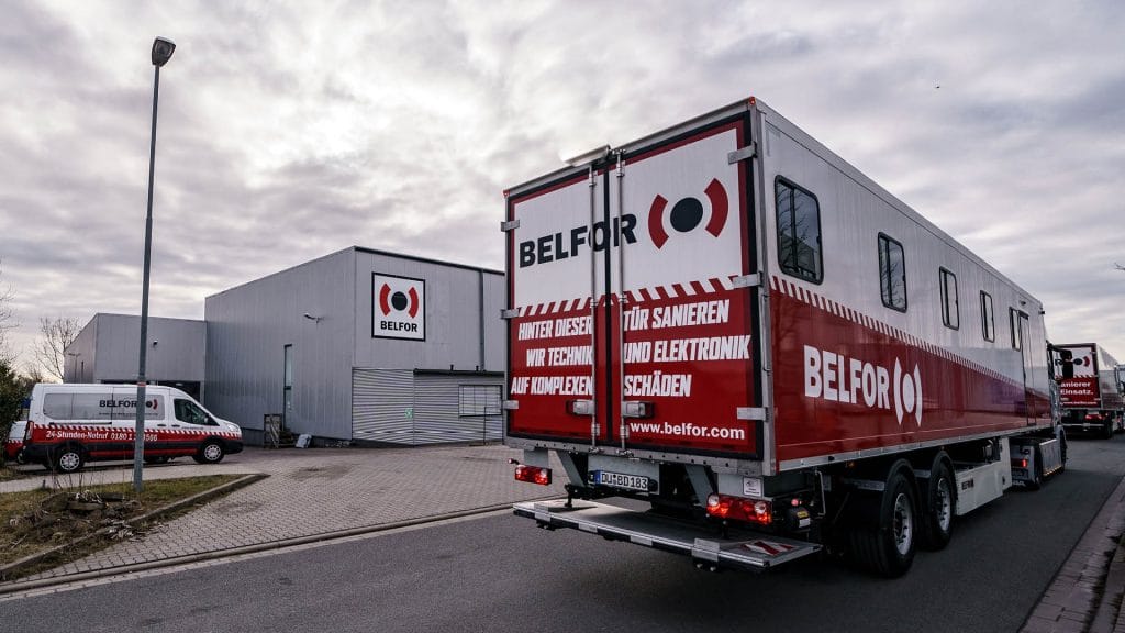 A BELFOR trailer infront of a BELFOR building