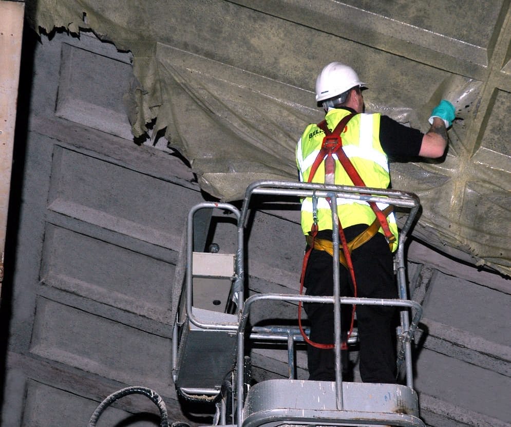 Soot Removal Film in action - spraying on ceiling industrial hall - removing the latex film