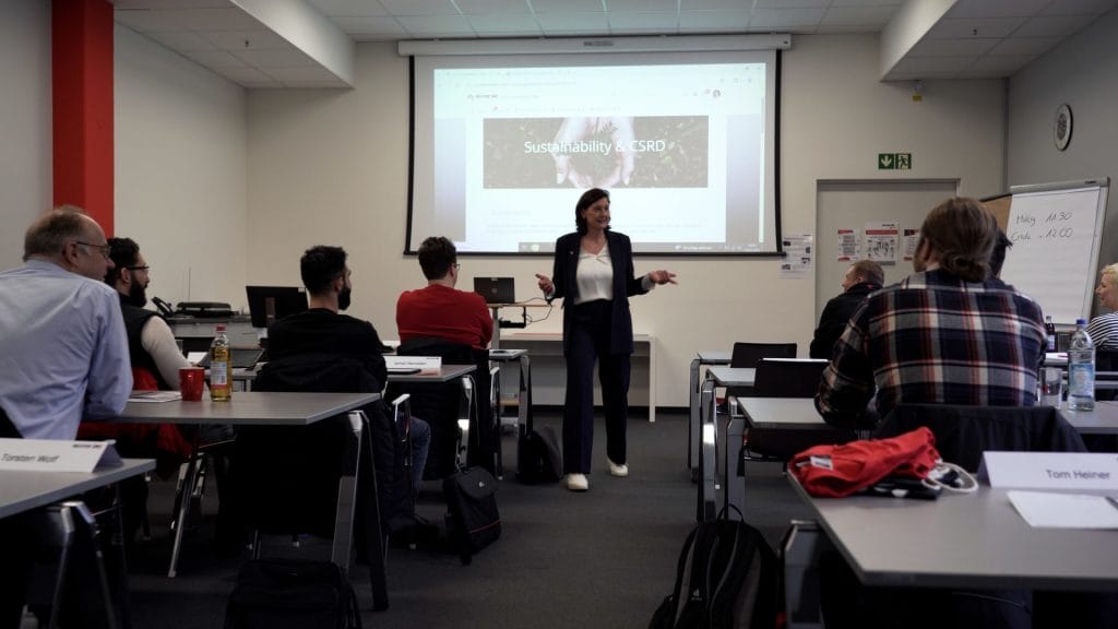 Woman holding a presentation infront of colleagues