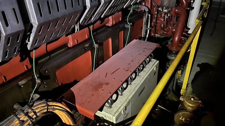 Engine room of a ship covered in soot after a fire