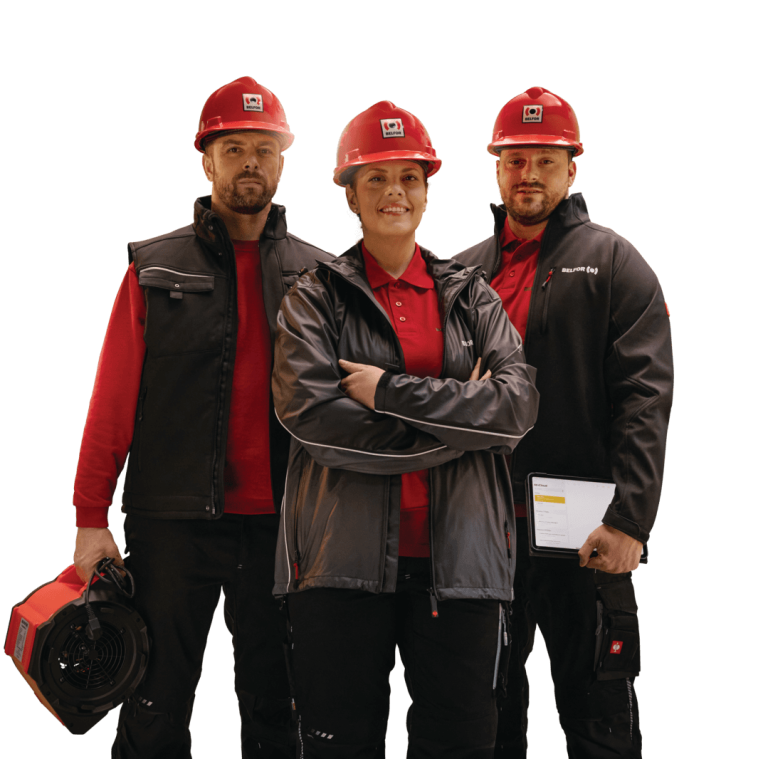 Three BELFOR workers with safety helmets